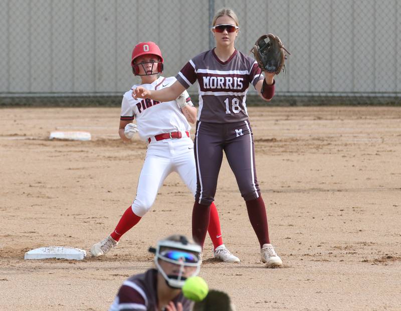 Ottawa's Hailey Larsen is safe at second base as Morris's Addison Stacy (bottom) catches a cut off catch while teammate Macie Ferguson (top) waits for the late throw on Monday, May 15, 2023 at Ottawa High School.