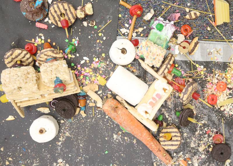 A large amount of food covers the floor during the 29th annual Edible Car Contest on Wednesday, Feb. 26, 2025 in the cafeteria at Illinois Valley Community College.