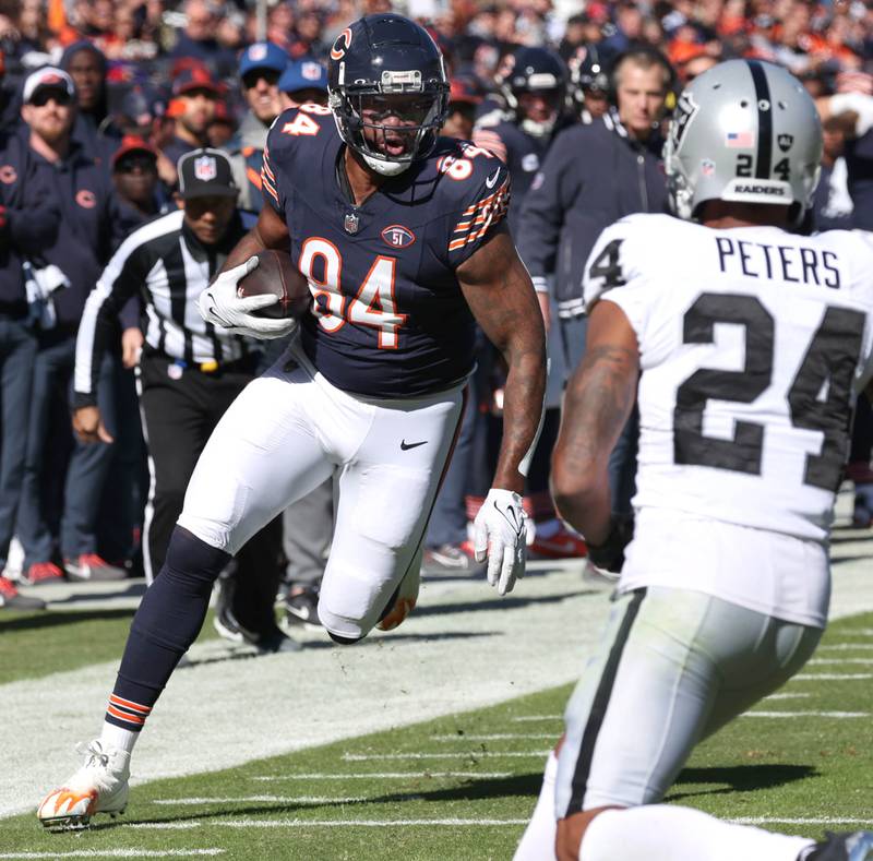 Chicago Bears tight end Marcedes Lewis looks to get by Las Vegas Raiders cornerback Marcus Peters after making a catch during their game Sunday, Oct. 22, 2023, at Soldier Field in Chicago.