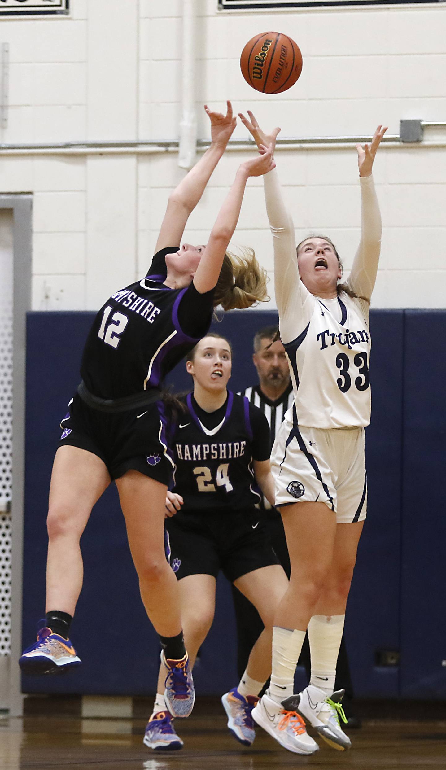 Hampshire's Kaitlyn Milison knocks a pass away from Cary-Grove's Ellie Mjaanes as her teammate. Hampshire's Whitney Thompson, tries to guard Mjaanes during a Fox Valley Conference girls basketball game Friday, Dec.2, 2022, between Cary-Grove and Hampshire at Cary-Grove High School in Cary.
