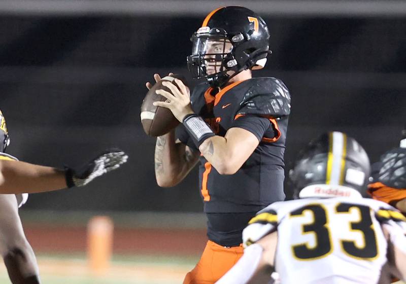 DeKalb's Adrien McVicar looks for a receiver during their game against Metea Valley Friday, Sept. 16, 2022, at DeKalb High School.