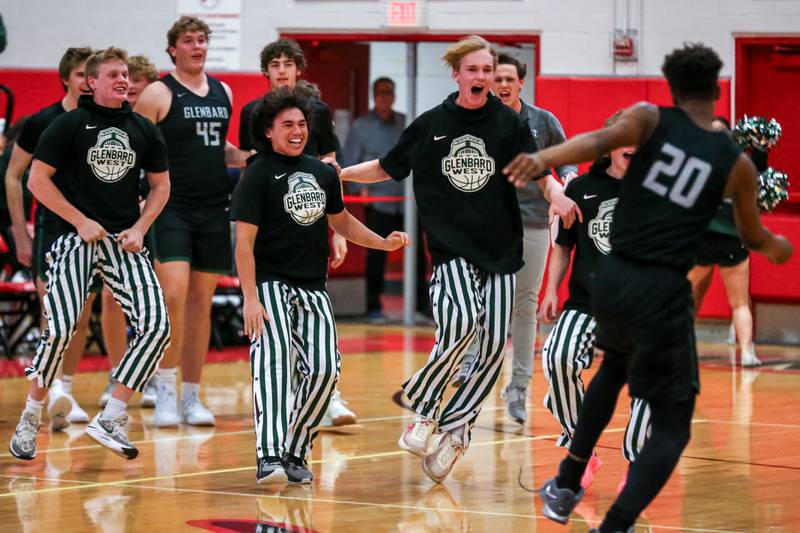 Glenbard West celebrates the win of their basketball game between Glenbard West at Hinsdale Central, Friday  Dec 6, 2024  in Hinsdale.