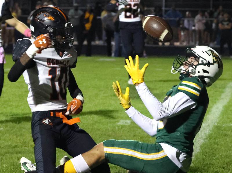 Waubonsie Valley’s Josh Tinney catches a pass behind the defense of DeKalb's Kemari Delgado during their game Friday, Oct. 11, 2024, at Waubonsie Valley High School in Aurora.