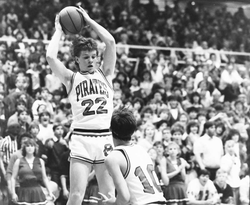 Ottawa's Brad Hartshornlooks to pass around L-P's Todd Anderson, during the Regional title game on Saturday, Feb. 28, 1986 at La Salle-Peru Township High School.