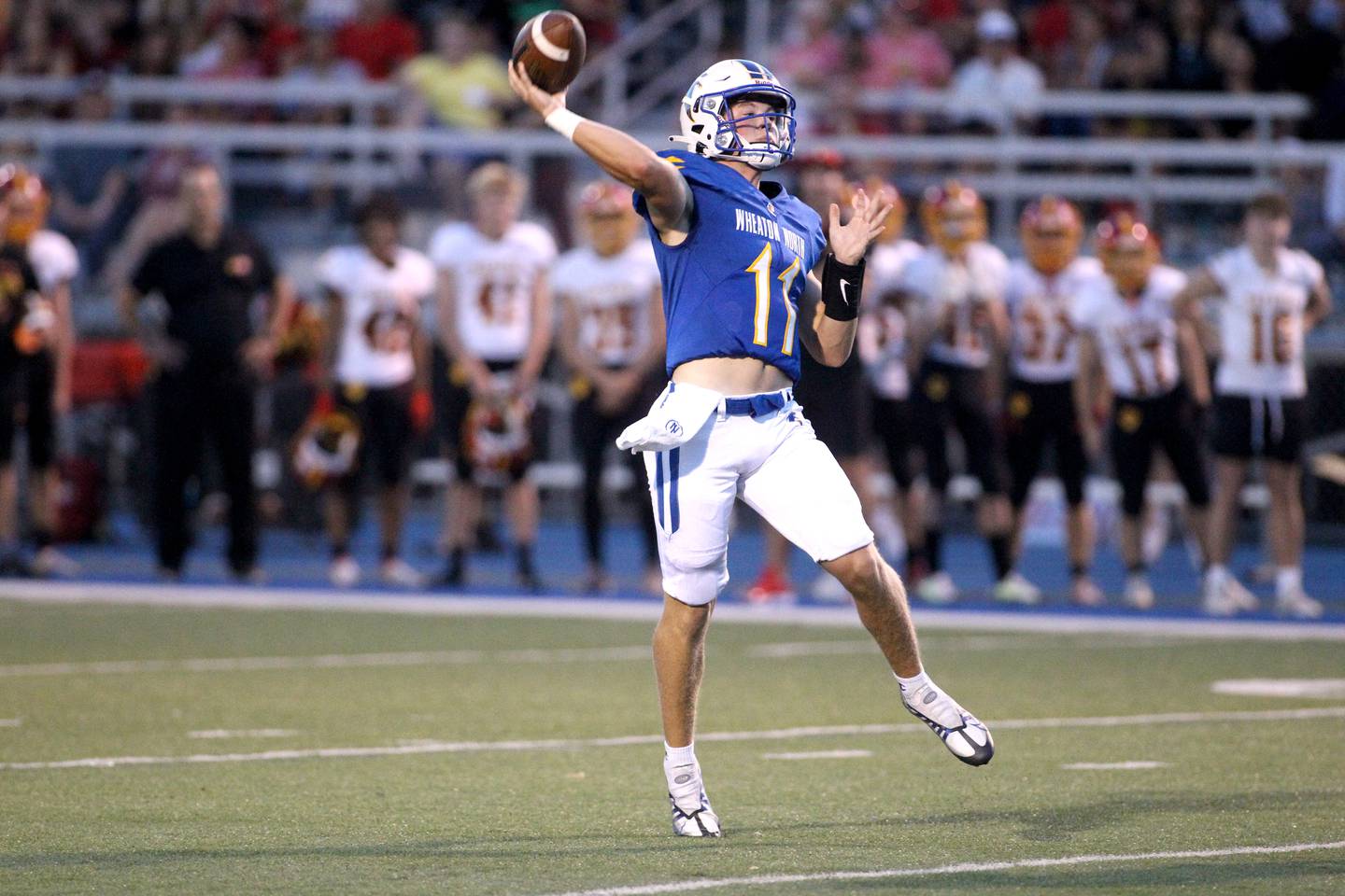 Wheaton North’s Max Howser throws for a touchdown during a home game against Batavia on Friday, Sept. 9, 2022.