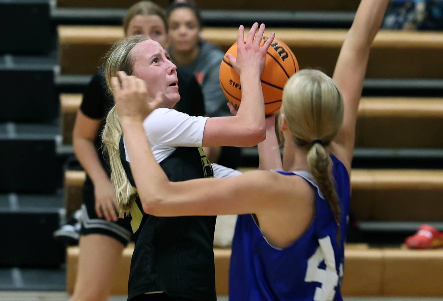 Sycamore’s Sadie Lang goes to the basket against Geneva’s Emma Peterson Thursday, June 12, 2025, in the Geneva High School Varsity Summer League.