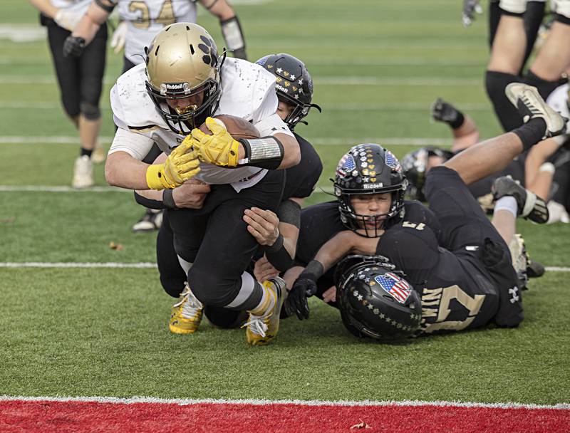 Camp Point's Elijah Genenbacher eyes the end zone to put his team up by two touchdowns late in the game against Lena-Winslow Friday, Nov. 24, 2023 in the 1A state football championship game at Hancock Stadium in Normal.