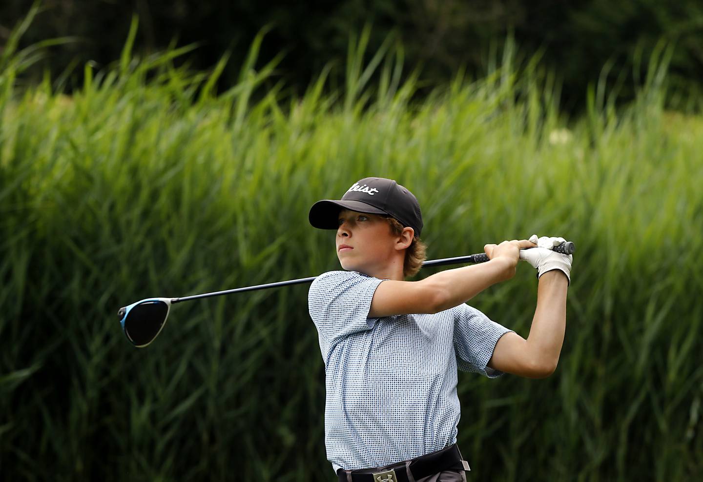 Central’s Tyler Samaan watches his tee shot on the first hole of the Prairie course Wednesday, July 12, 2022, during the second round of the the McHenry County Junior Golf Association's McHenry County Junior Amateur tournament at Boone Creek Golf Club, in Bull Valley.