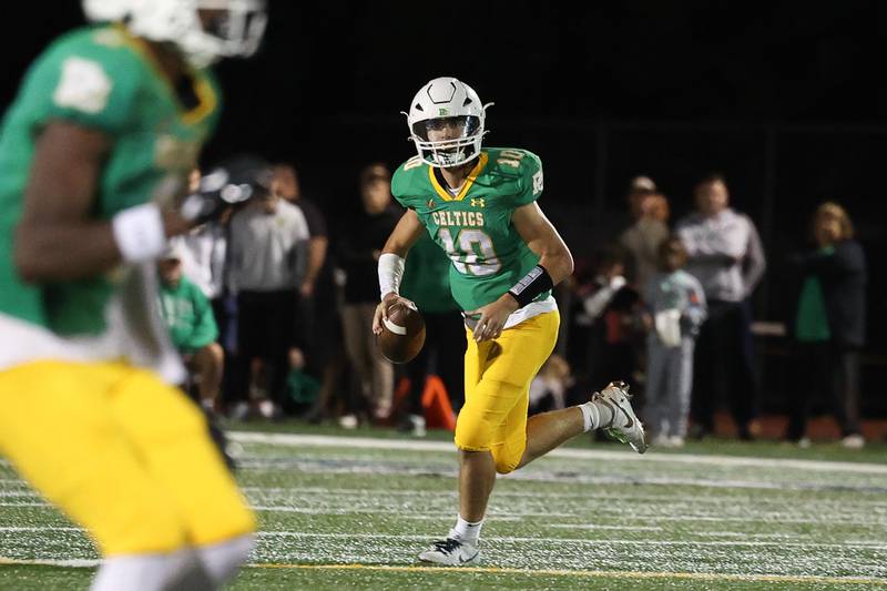 Providence’s Leo Slepski rolls out to pass against Lincoln-Way Central on Friday, Sept. 6, 2024 in New Lenox.