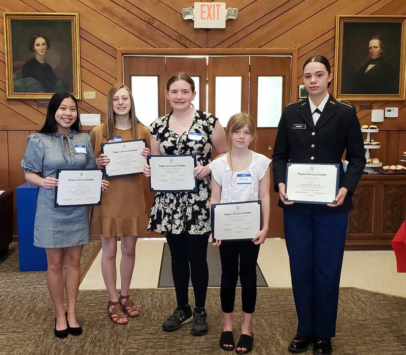 The General John Stark Chapter Daughters of the American Revolution award program winners My Vo, Chloe Harbecke, Mikacla Lea Trea, Sierra LaPorte, and Cadet Elizabeth Carney