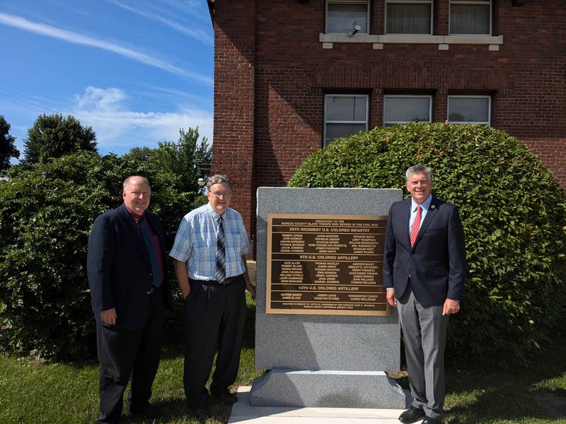 Bureau County History Center Executive Director Lex Poppens (left), BCHC Board President Jim Dunn (middle) and U.S. Rep. Darin LaHood stand next to the new monument commemorating Black soldiers from the Civil War on Aug. 7, 2024, at the history center campus in Princeton.