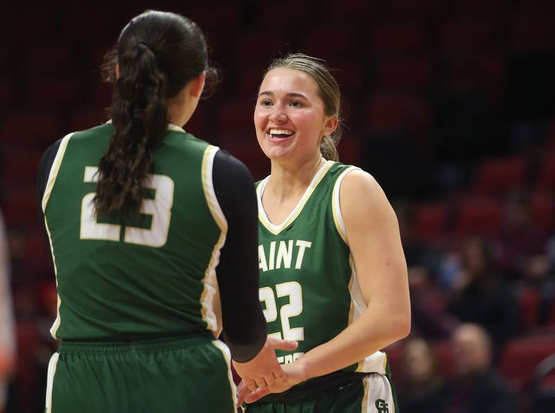St. Bede's Ella Hermes smiles with teammate Ali Bosnich after hitting a three point basket against Altamont during the Class 1A third-place game on Thursday, Feb. 29, 2024 at CEFCU Arena in Normal.