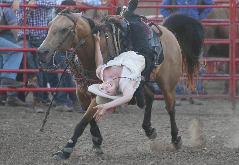 Shelby LeAnne Danison of Western Way Entertainment performance company in Sevierville, Tenn., performs stunts on horseback during the Starved Rock Rodeo on Saturday, June 21, 2025 at the La Salle Speedway.