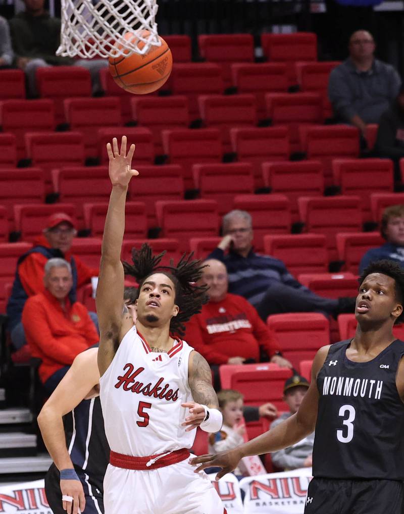 Northern Illinois' Kailon Nicholls gets to the basket in front of Monmouth's Madison Durr during their game Tuesday, Nov. 12, 2024, in the Convocation Center at NIU in DeKalb.