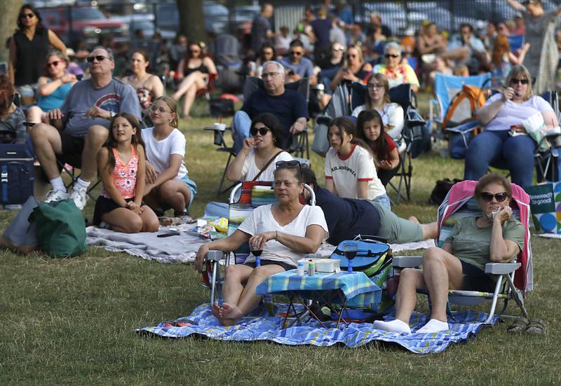 People watch as members of Serendipity perform during the Crystal Lake Park District's Concert in the Park on Tuesday, June 17, 2025, at Main Beach in Crystal Lake. The concert was part of the park district's weekly Tuesday night summer concert series.