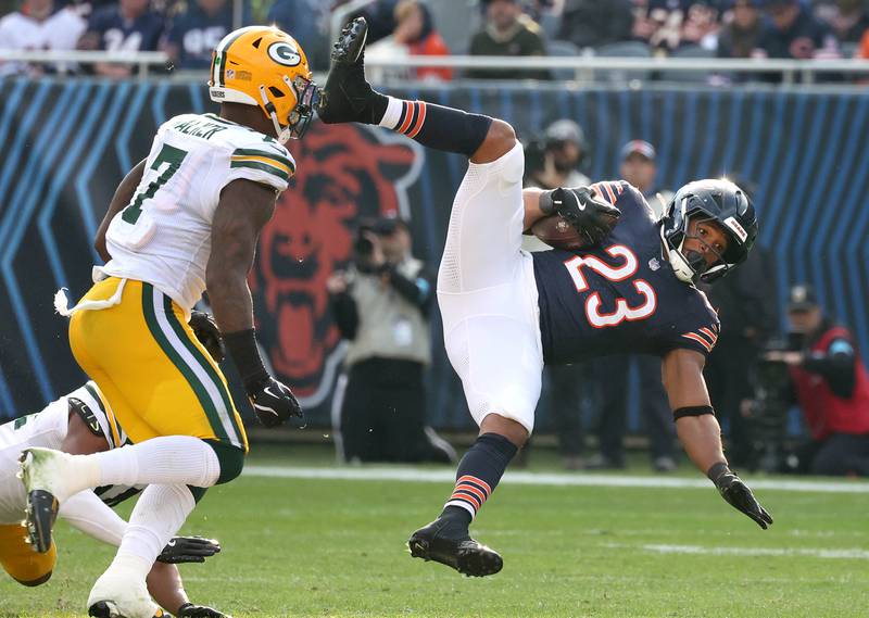 Chicago Bears running back Roschon Johnson tries to hurdle Green Bay Packers cornerback Carrington Valentine Sunday, Nov. 17, 2024, during their game at Soldier Field in Chicago.