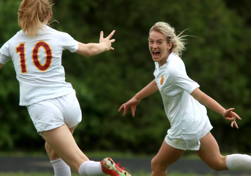 Richmond-Burton’s Reese Frericks, right, howls with delight after scoring a second-half goal against DePaul Prep during sectional title game action at Marian Central in Woodstock Friday evening. Coming to greet Frericks is Margaret Slove, left.