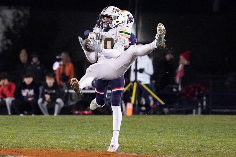 Waubonsie Valley's Josh (10) catches a pass against Oswego’s Jeremiah Cain (1) during a Class 8A first-round playoff game at Oswego High School on Friday, Nov. 1, 2024.