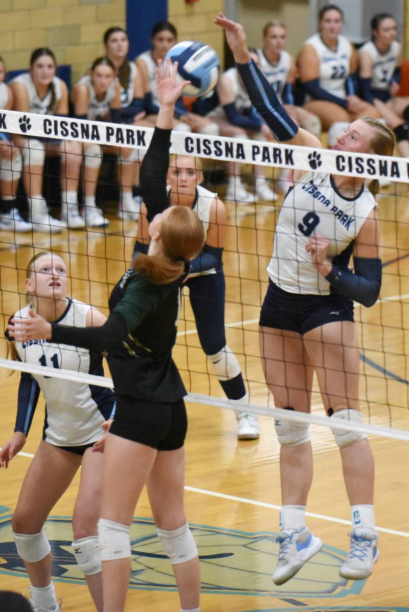 Cissna Park's Addison Lucht, right, and Bishop McNamara's Montana Reid battle at the net during a game at Cissna Park Wednesday, Oct. 15, 2025.