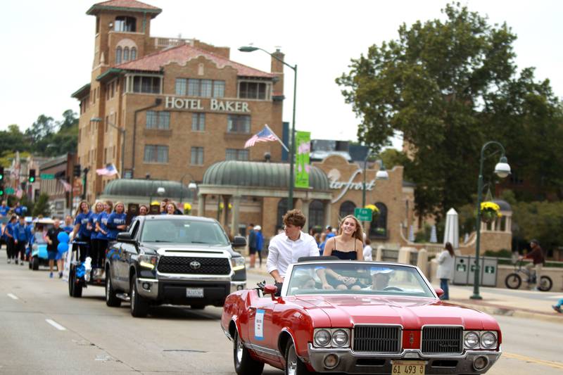 St. Charles North students Ty Heimbach and Paige Murray represent the school’s baseball and softball teams on Friday, Sept. 27, 2024 during the school’s annual homecoming parade in St. Charles.