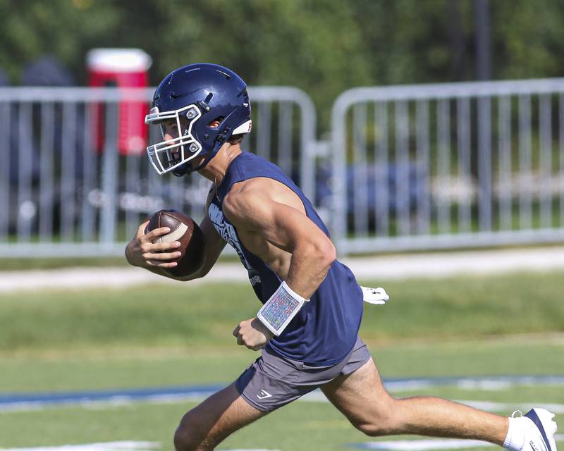 Jackson Failla runs with the ball at Nazareth Academy Football Practice, Monday, Aug 11, 2025  in La Grange.