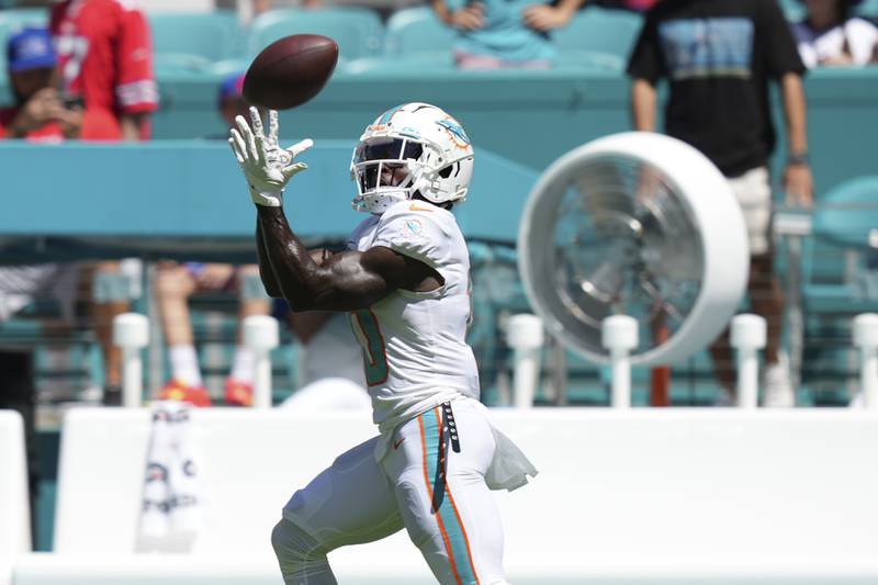Miami Dolphins wide receiver Tyreek Hill (10) catch a pass during warmups before an NFL football game against the Buffalo Bills, Sunday, September 25, 2022 in Miami Gardens, FL. The Dolphins defeat the Bills 21-19. (Peter Joneleit via AP)