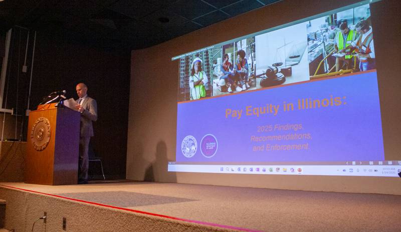 Jason Keller, assistant director of the Illinois Department of Labor, speaks at a seminar about recent findings of a report on pay equity in Illinois. The report is the first released since a 2021 amendment to the Equal Pay Act required certain business owners to report wage and demographic data.