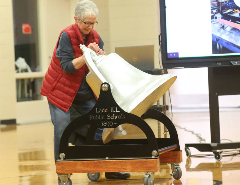 Ladd school board secretary Jane Piccatto, rings a fully restored 1890 school bell for the first time on Monday, May 19, 2025, at Ladd Grade School. The bell was restored by Valley Fabrication Inc. and weighs just shy of 1,000 pounds. In 1890, the Whitebreast Fuel Co. in Iowa completed a coal mine shaft on the north end of Ladd and the village was founded that same year. At the start of the school year in 1890, construction was started on a wooden two-story school building and land donated by the coal company. The school was completed in the spring of 1891 and opened in April.