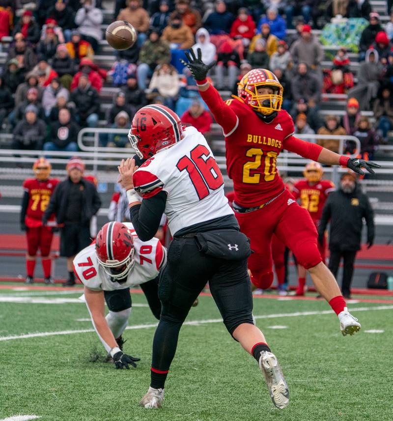 Batavia’s Brody Osborne (20) pressures Yorkville's Michael Dopart (16) during a 7A quarterfinal playoff football game at Batavia High School on Saturday, Nov 12, 2022.