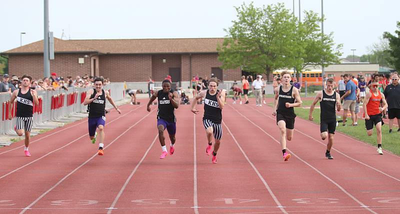 Kaneland's Chris Ruchaj, Plano's Tristan Meszaros and Waleed Johnson, Kaneland's Jake Gagne, Sycamore's Aidan Wyzard and Brandon Siebens and Sandwich's Nathan Hill compete in the 100 meter dash during the I-8 Boys Conference Championship track meet on Thursday, May 11, 2023 at the L-P Athletic Complex in La Salle.