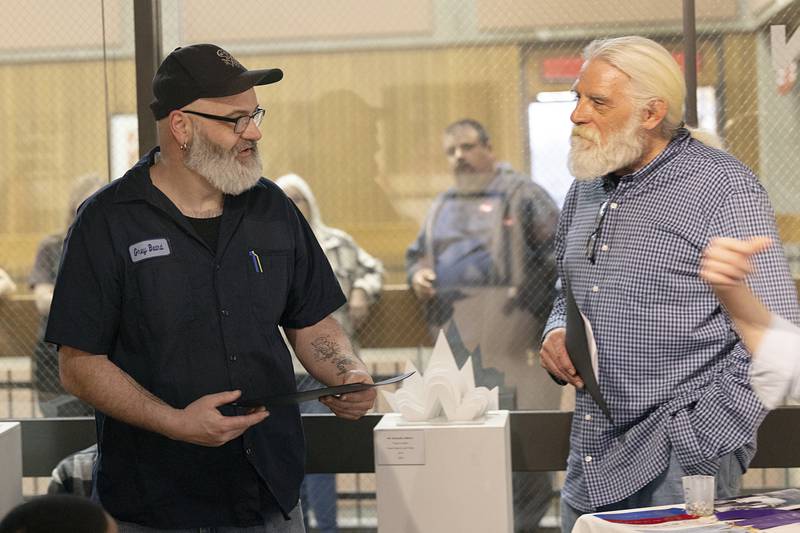Daroll French (left) accepts a third-place award for his multimedia piece, titled “Polka Trash”, from SVCC art professor Glen Bodish on Thursday, April 9, 2026.