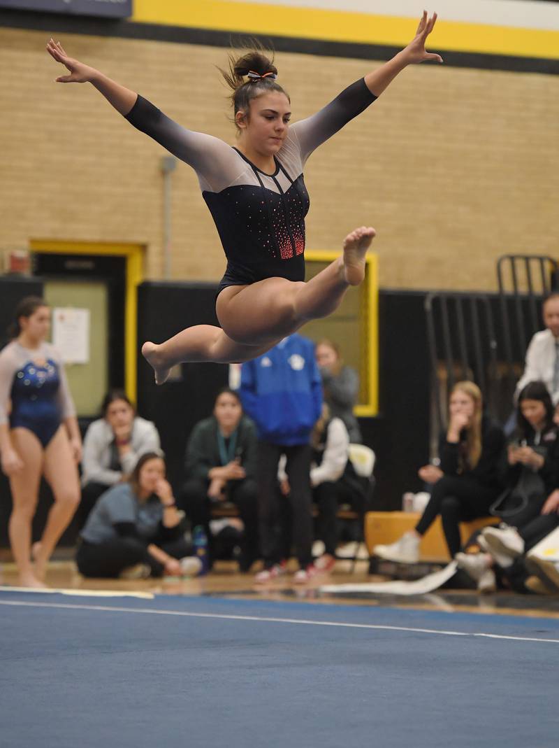 Oswego’s Gianna Muratore performs her floor exercise routine at the Hinsdale South girls gymnastics sectional meet in Darien on Tuesday, February 7, 2023.