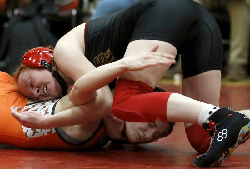 Morris’ Makensi Martin tries to control DeKalb’s RaeAnne Sciabaras in the 115-pound match of a nononference wrestling meet on Wednesday, Jan. 22, 2025, at Huntley High School.