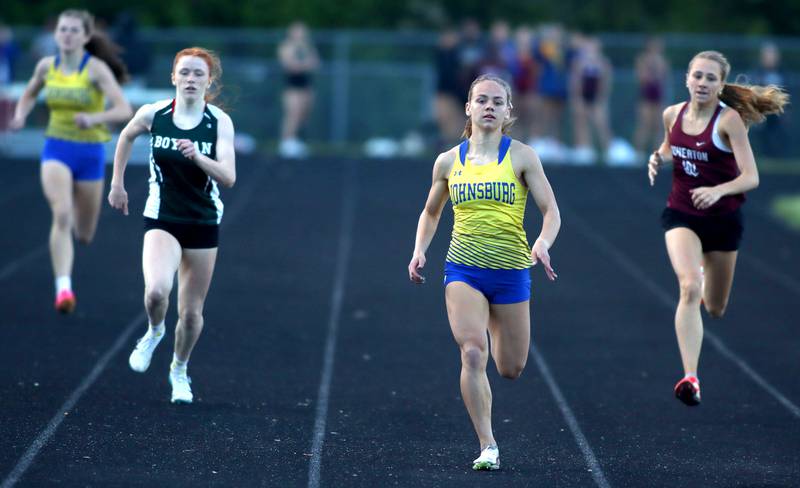 Hope Klosowicz, center right, sets the pace in the 400 meters in IHSA Class 2A Girls Sectional Track action at Genoa-Kingston School in Genoa on Friday, May 16, 2025.