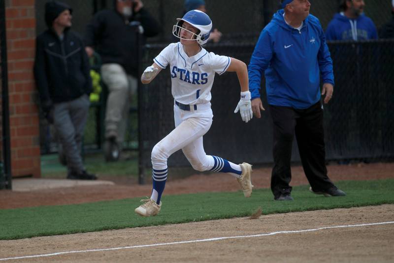 St. Charles North's Ella Heimbuch runs home for a score during a game against Lake Park on Wednesday, April 30, 2025 in St. Charles.