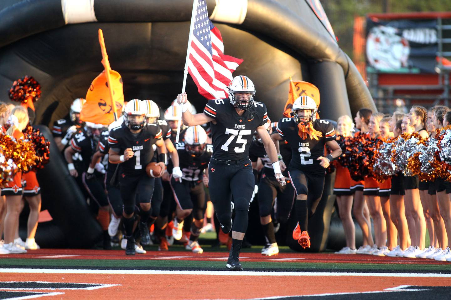 St. Charles East players take the field before their season opener against Lincoln-Way Central at home on Friday, Aug. 26, 2022.