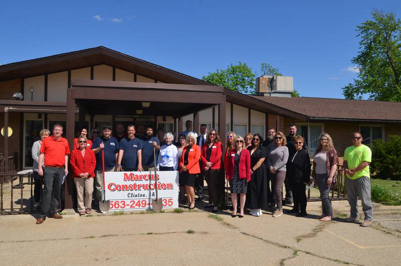 Jason Marcus (front row, fifth from left) is the developer of the new Cattail Village in Fulton, Ill. Economic development officials from Fulton, Whiteside County, and Clinton, Iowa, celebrated a ground-breaking ceremony at the site on Tuesday, April 30.