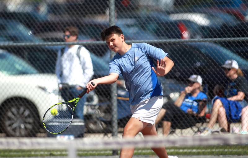 Woodstock’s Liam Hanson returns the ball during a doubles match with partner Devon Oliveira (not pictured) in the state championship preliminaries at Palatine High School on Thursday, May 23, 2024.