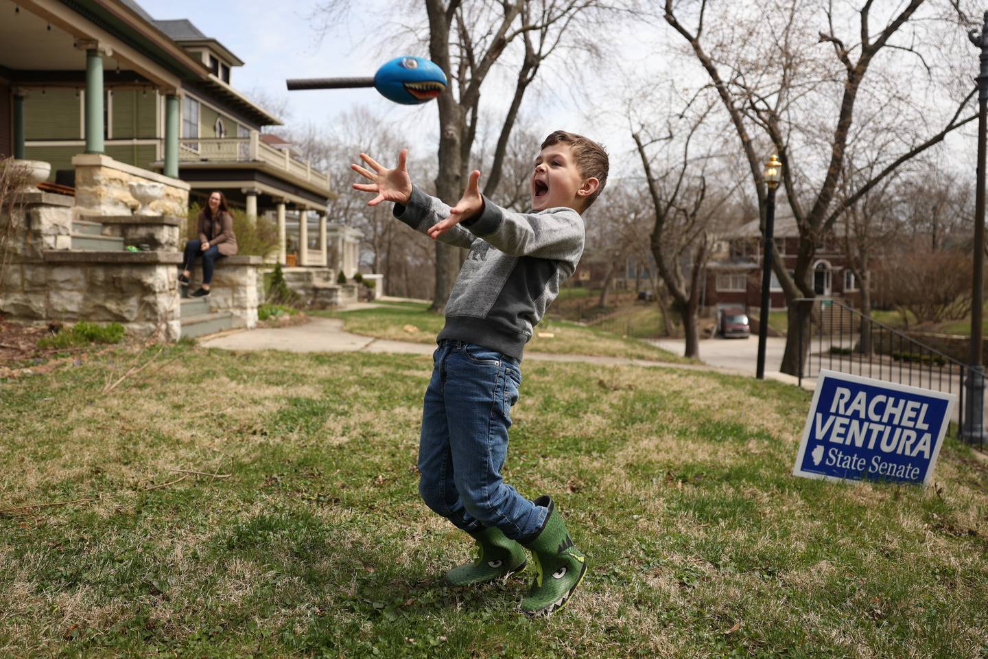 Owen Brzycki plays catch with his father as his mother Emily watches at their home in Joliet. Friday, April 15, 2022, in Joliet.