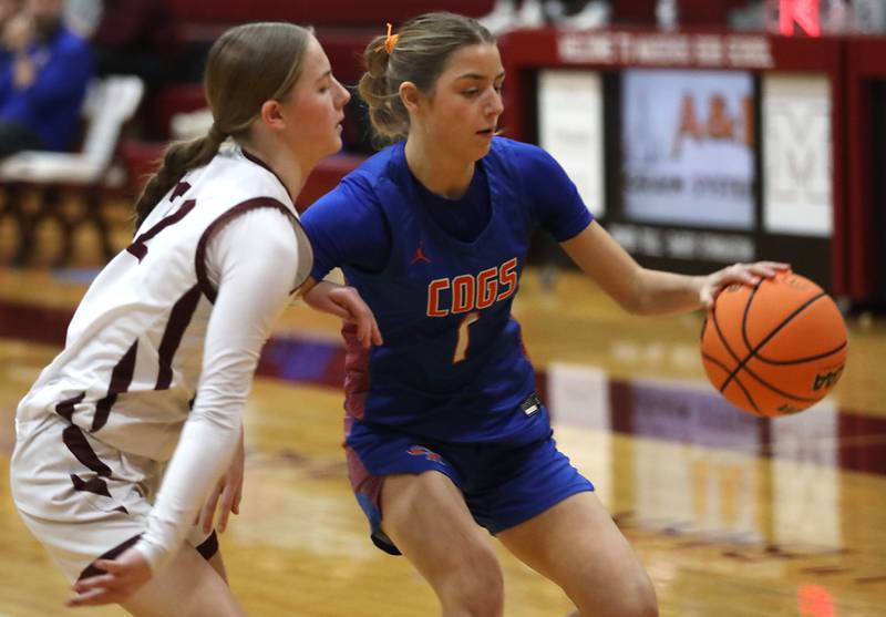 Genoa-Kingston's Presley Meyer (right) brings the ball up the court against Marengo's Sophie Hanson during an IHSA Class 2A Marengo Regional semifinal girls basketball game on Monday, Feb. 16, 2026, at Marengo High School.