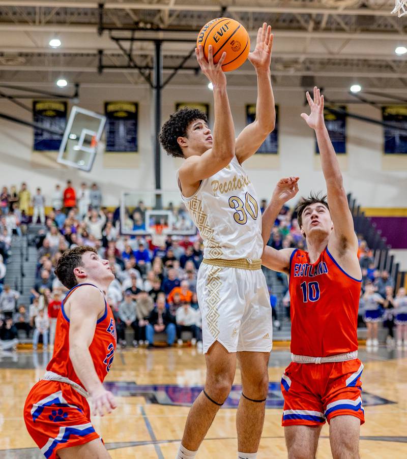Pecatonica sophomore Zion Braimah goes up for the shot against Eastland's Zyacn Haverland. Eastland defeated Pecatonica 36-31 to claim the sectional championship.