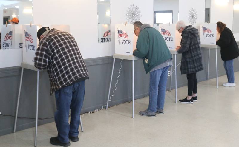 Voters fill ballots in voting booth on Tuesday, March 17, 2026 at the Ottawa Lions Club.