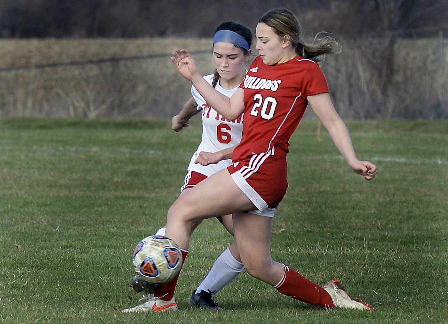 Streator's Anna Jaworski (20) beats Ottawa’s Lexi Serna (6) to the ball Friday, April 1, 2022, at the Streator Family YMCA.