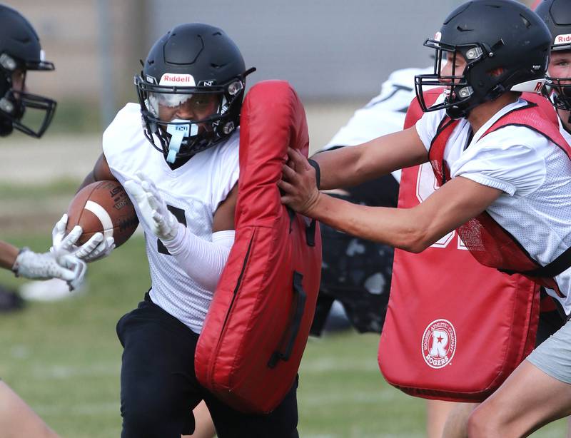 Sycamore’s Tyler Curtis carries the ball during practice Monday, Aug. 7, 2023, at Sycamore High School.