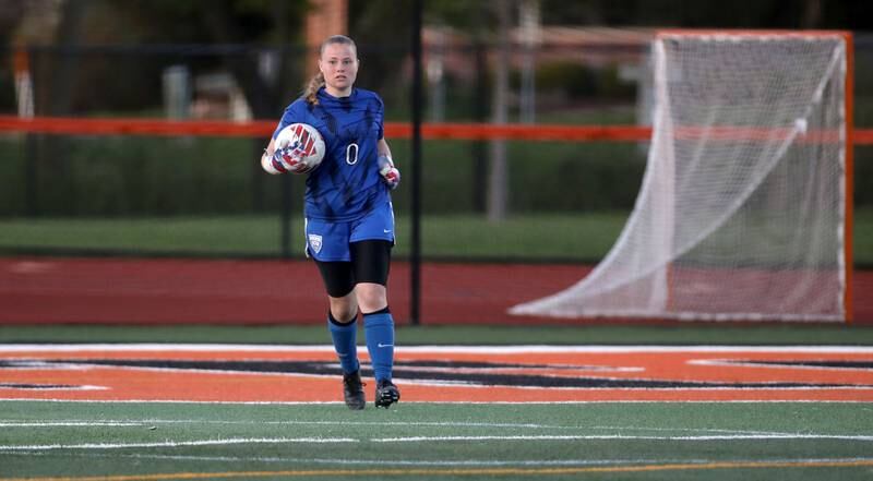 St. Charles North goal keeper Lauren Korioth scoops up the ball during a Tri-Cities Soccer Night game against St. Charles East on Tuesday, April 29, 2025 in St. Charles.