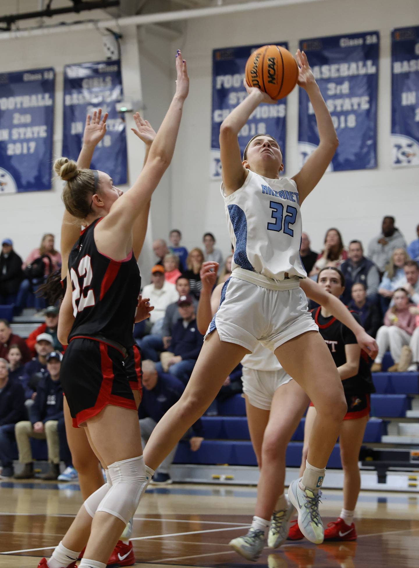 Nazareth's Stella Salalas  (32) puts up a shot during a girls varsity basketball game between Benet and Nazareth academies on Saturday, Dec. 14, 2024 in La Grange Park.