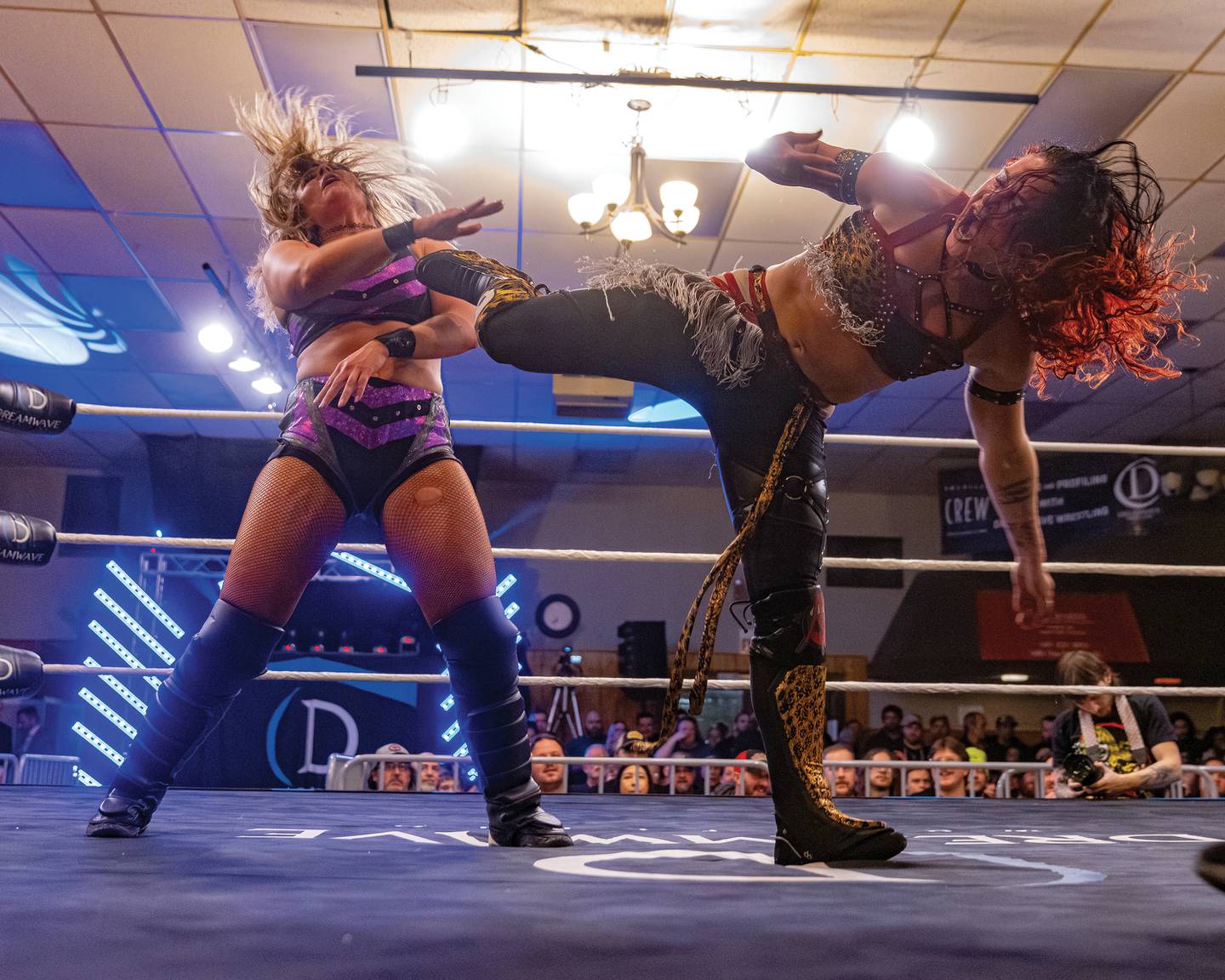Masha Slamovich (right) kicks Sierra during their match at Dreamwave Wrestling's "Famous Last Words" event Feb. 8, 2025, at the Knights of Columbus hall in La Salle.