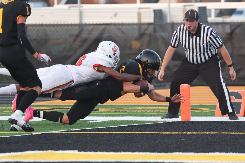 Joliet West’s Juan Rico lunges for the touchdown during a drive off an onside kick recovery against Shepard on Friday, Aug. 25, 2023 in Joliet.