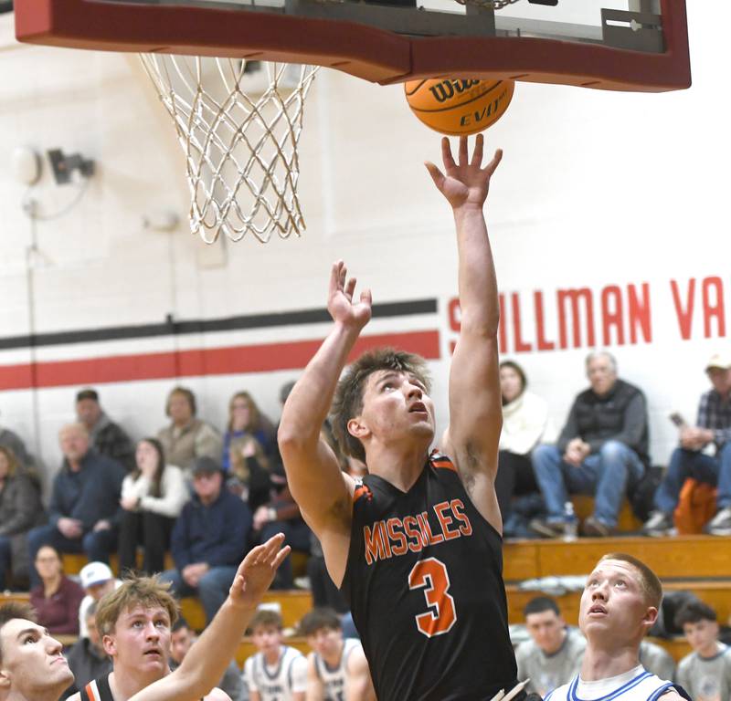 Milledgeville's Konner Johnson (3) shoots against Sterling Newman on Saturday, Dec. 13, 2025 at the 64th Annual Forreston Holiday Basketball Tournament at Forreston High School.