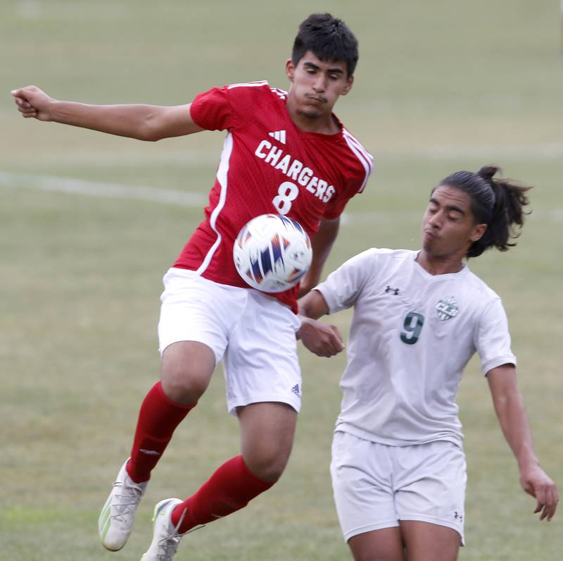 Dundee-Crown's Yonatan Lechuga tries to control the ball in front of Crystal Lake South's Ali Ahmed during a Fox Valley Conference soccer match Tuesday, Sept. 5, 2023, at Dundee-Crown High School in Carpentersville.